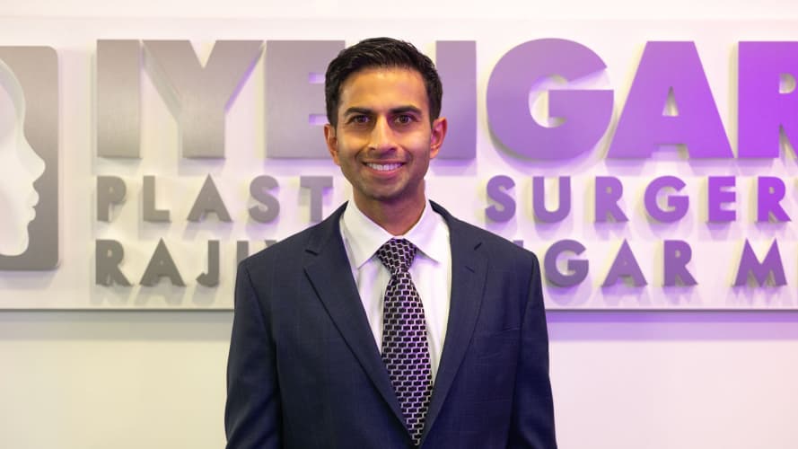 Profile image of Dr. Iyengar in front of his logo in the practice